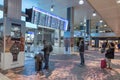 GENEVA, SWITZERLAND - JANUARY 16, 2018: Geneva International Airport in Switzerland. Departure Interior Area. People Looking intoT