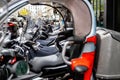 Geneva, Switzerland - April 14, 2019: A row of scooters parked along the street. Side view Royalty Free Stock Photo