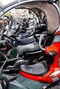 Geneva, Switzerland - April 14, 2019: A row of scooters parked along the street. Side view Royalty Free Stock Photo