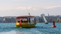 Geneva, Switzerland - April 14, 2019: View of a yellow and red Mouettes Genevoises Navigation boat, a public transport boat Royalty Free Stock Photo