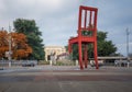 Place des Nations and Broken Chair sculpture by artist Daniel Berset, United Nations Office on background - Geneva, Switzerland Royalty Free Stock Photo