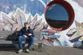 GENEVA, SWITZERLAND - FEBRUARY, 2019 - Woman walk near the mural of the Grottes school playground adjacent to Jean-Robert-Chouet t