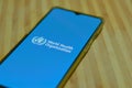 Geneva, Switzerland, 2020. Flat lay with mobile phone screen showing World health organization WHO landing page & emblem. Royalty Free Stock Photo