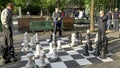 GENEVA, SWITZERLAND - JUNE, 7, 2019: player contemplating next move in an outdoor chess game in geneva