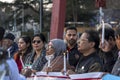 Bangladeshi people protesting at the Broken Chair monumental sculpture in front of the UN office in Geneva, Switzerland