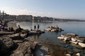 People enjoying the scenic view of the Geneva Lake at the Bay of Geneva, the French section of Switzerland Royalty Free Stock Photo