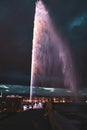 Night view of the Jet d\'Eau, a large fountain in Geneva, Switzerland and is one of the city Royalty Free Stock Photo