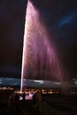 Night view of the Jet d\'Eau, a large fountain in Geneva, Switzerland and is one of the city Royalty Free Stock Photo