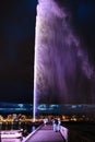 Night view of the Jet d\'Eau, a large fountain in Geneva, Switzerland and is one of the city Royalty Free Stock Photo