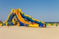 Inflatable water slide on beach of Azov sea