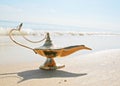 Genies lamp on seashore Royalty Free Stock Photo