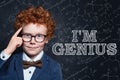 Genius child on blackboard background with science and maths formulas Royalty Free Stock Photo