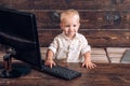 Genius child type computer keyboard. Genius toddler use new technology in kindergarten. In touch with tomorrow