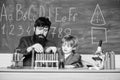 Genius kid. Joys and challenges raising gifted child. Teacher bearded scientist man child test tubes. Chemical