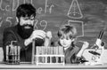 Genius kid. Teacher child test tubes. Achieving developmental milestones way before predicted sign that child ready to Royalty Free Stock Photo