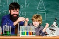 Genius kid. Teacher child test tubes. Achieving developmental milestones way before predicted sign that child ready to Royalty Free Stock Photo