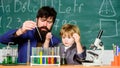 Genius kid. Teacher child test tubes. Chemical experiment. Achieving developmental milestones way before predicted sign Royalty Free Stock Photo