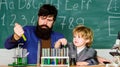 Genius minds. Genius kid. Joys and challenges raising gifted child. Teacher bearded scientist man child test tubes