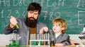 Genius minds. Genius kid. Joys and challenges raising gifted child. Teacher bearded scientist man child test tubes
