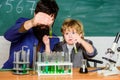 Genius minds. Signs your child could be gifted. Genius toddler private lesson. Genius kid. Teacher child test tubes Royalty Free Stock Photo