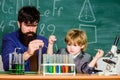 Genius minds. Genius toddler private lesson. Genius kid. Teacher child test tubes. Achieving developmental milestones Royalty Free Stock Photo