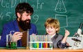 Genius minds. Genius toddler private lesson. Teacher child test tubes. Genius kid. Achieving developmental milestones Royalty Free Stock Photo