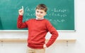 Genius schoolboy could solve the math task Royalty Free Stock Photo