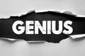 GENIUS text under torn paper. Concept for intelligence, innovation, creativity, talent, and extraordinary ideas symbolizing smart Royalty Free Stock Photo