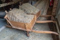 Wooden wheelbarrows loaded with straw, Domein Bokrijk, Genk, Belgium