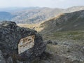 Gennargentu mountain, Sardinia, Italy, September 12, 2020: rusty metal notice sign Punta La Marmora highest mountain Royalty Free Stock Photo