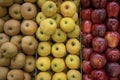 Gennevilliers, France - 01 21 2022: Primeur fruits and vegetables. Detail of mixed apples at a greengrocer