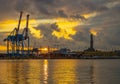 View of Lanterna lighthouse in the port of the city of Genoa at sunset with cloudy sky Royalty Free Stock Photo