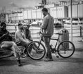 Genoa, Italy - April 21, 2016: Four African men enjoying the f