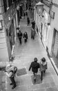 Genoa, Italy - April 21, 2016: Italian passers waling by narrow