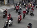 GENOA, ITALY - DECEMBER 23 2023 - The parade of Santas on motorcycles