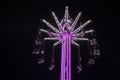 Carousel in the Luna Park of Genoa by night, Italy