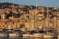 View of boats in the port of Genoa, Italy. On the background interesting view of buildings on the Royalty Free Stock Photo