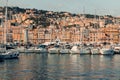 View of the port of Genoa full of yachts, boats - in the background high-rise buildings