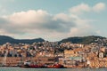 View of the port of Genoa full of yachts, boats - in the background high-rise buildings