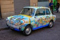 Colorful decorated vintage car with symbols of the city Genoa, Italy