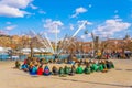 GENOA, ITALY, MARCH 13, 2016: A group of scouts is sitting in the port of genoa in front of the BIGO tourist crane Royalty Free Stock Photo