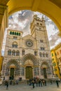 GENOA, ITALY, MARCH 13, 2016: people are walking in front of the cathedral of saint lorenzo in the italian city genoa