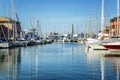 Genoa, Italy, 10/05/2019: Marina in a European city with white yachts on a bright sunny day. Beautiful seascape