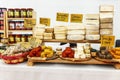 Genoa, Italy, 10/04/2019: Sale of different varieties of cheese on the counter. Close-up. Space for text