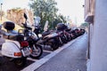 Genoa, Italy - September, 25, 2019: Motorcycles, scooters, bikes, mopeds Parking on street of Genoa city in Italy