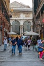 Genoa, Italy: Street with walking people