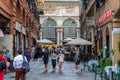 Genoa, Italy: Street with walking people near the Church of Saint Peter in Banchi