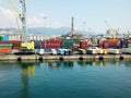 Genoa lighthouse in a port with colorful wagons Royalty Free Stock Photo