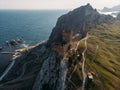 Genoese fortress in Sudak, Crimea. Aerial panorama view of ruins of ancient historic castle or fortress on crest of mountain Royalty Free Stock Photo