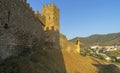 Genoese fortress in Sudak, Crimea. The shadow of the tower on the fortress wall. Royalty Free Stock Photo